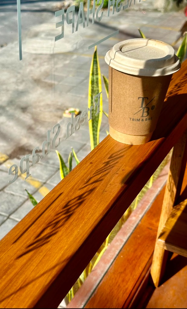 Daily Takeaway Coffee on Wooden Deck